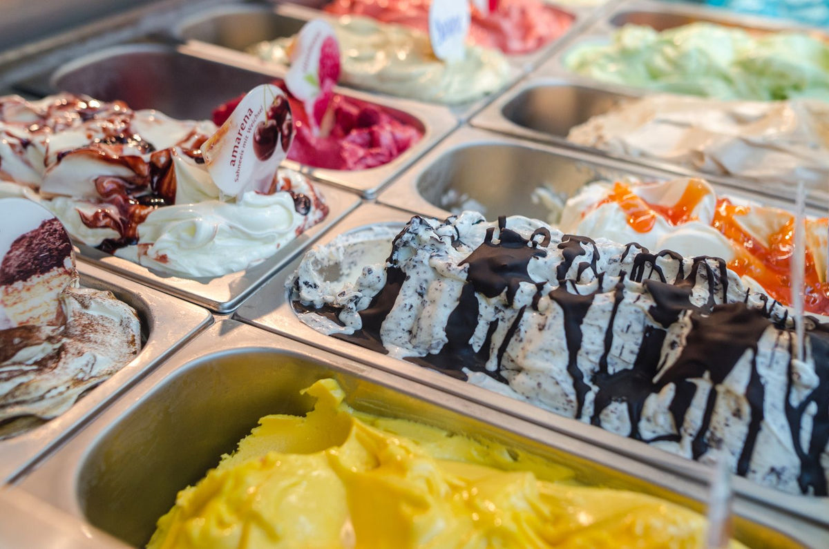 Dessert board with frozen coconut bites, berries and chocolate